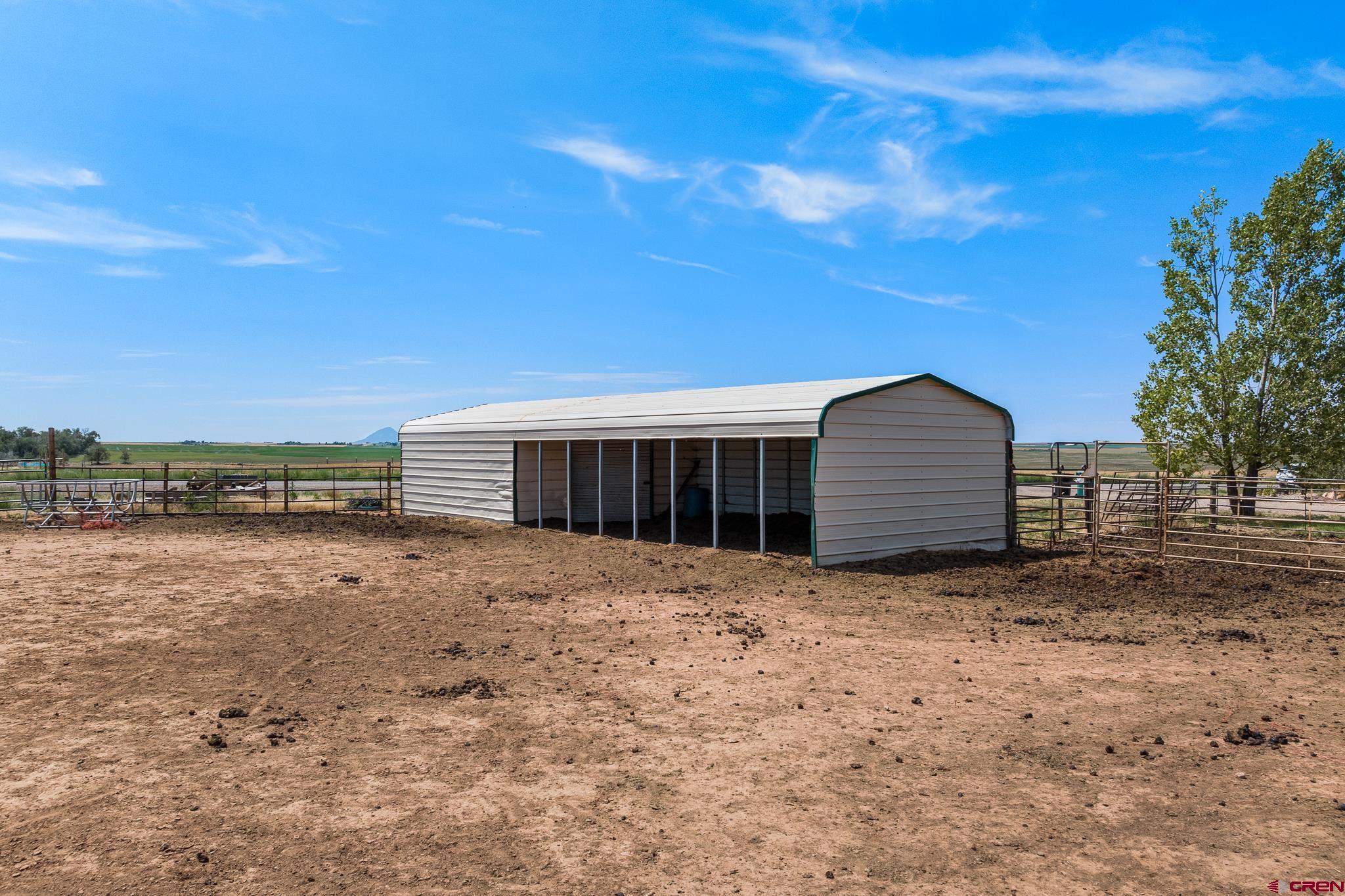 13723 Rd T Cahone, CO 81320 - Photo 31 of 36 a view of a house with a yard