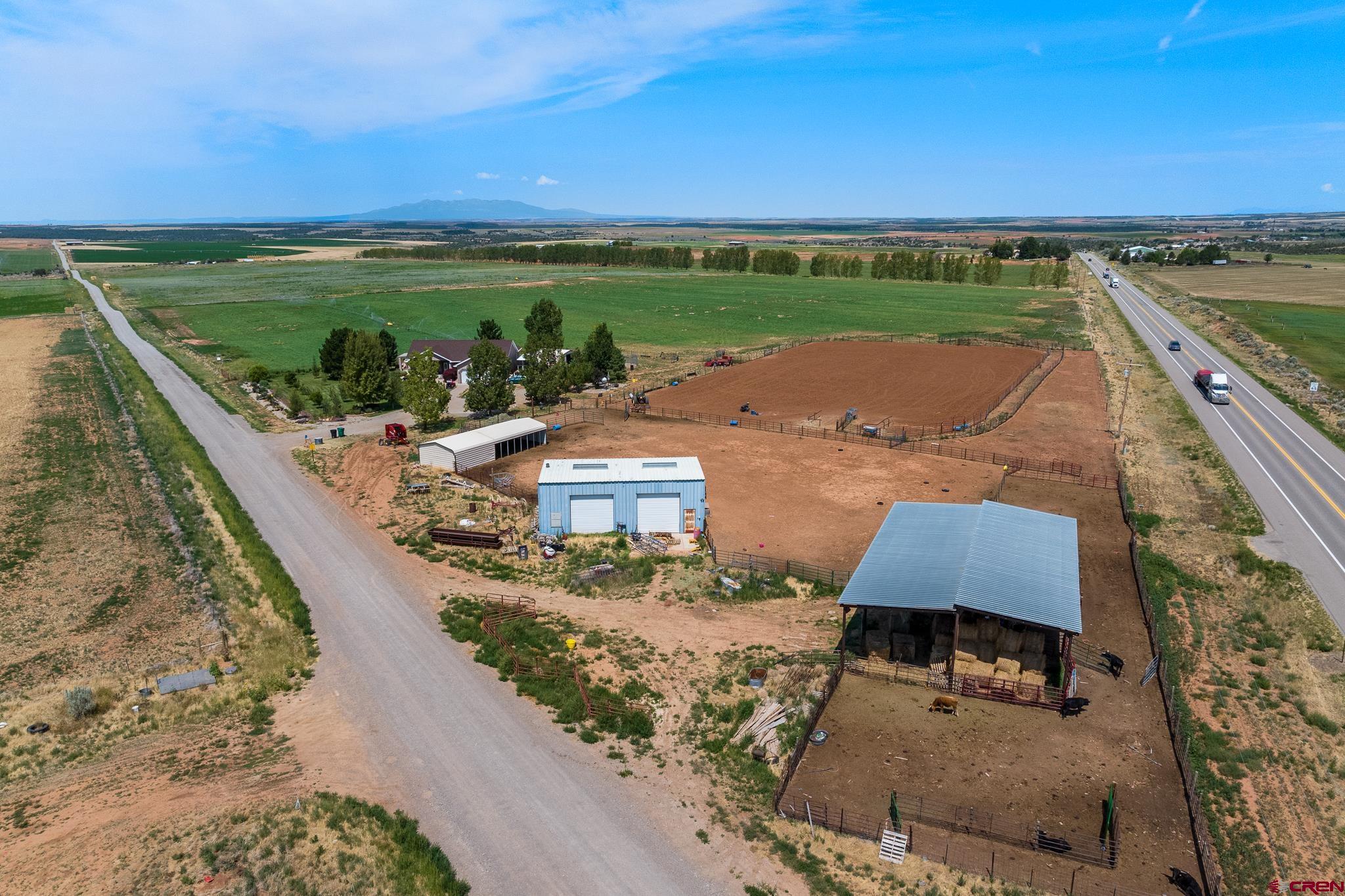 13723 Rd T Cahone, CO 81320 - Photo 34 of 36 an aerial view of a house with a lake view
