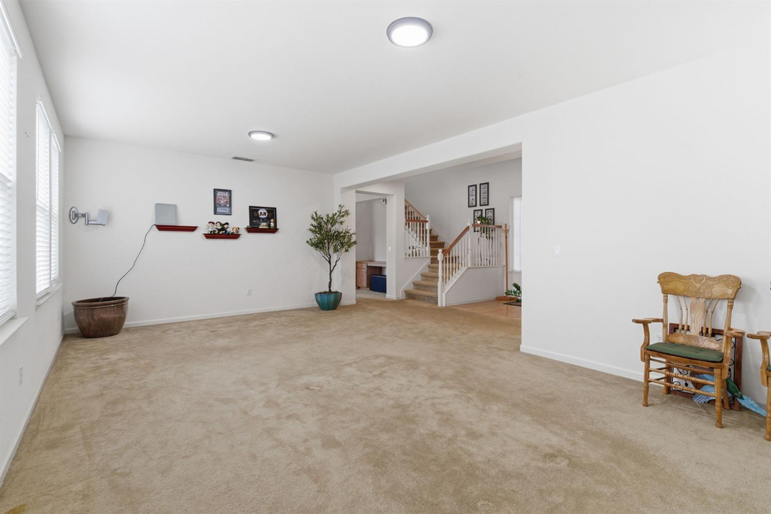 1806 West Ripon Road Ripon, CA 95366 - Photo 11 of 65 a view of livingroom with furniture and a refrigerator