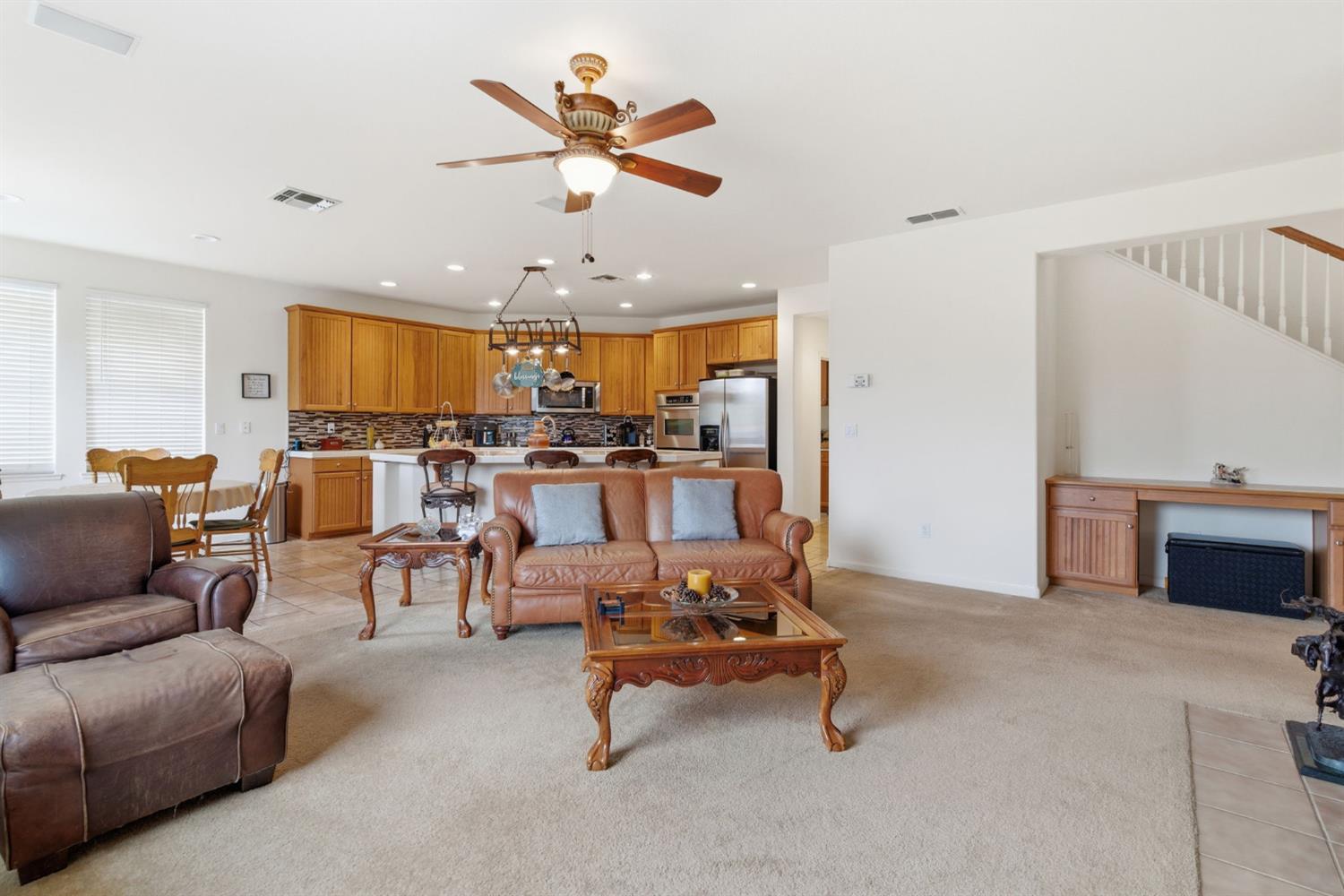 1806 West Ripon Road Ripon, CA 95366 - Photo 15 of 65 a living room with furniture kitchen view and a chandelier