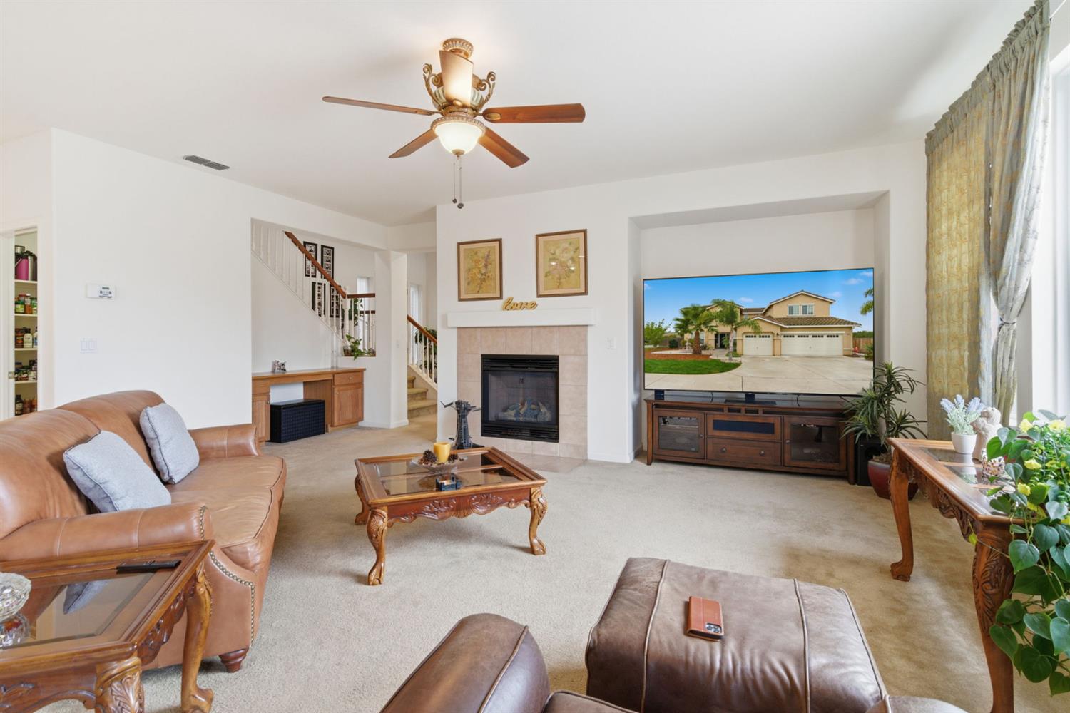 1806 West Ripon Road Ripon, CA 95366 - Photo 16 of 65 a living room with furniture fireplace and a large window