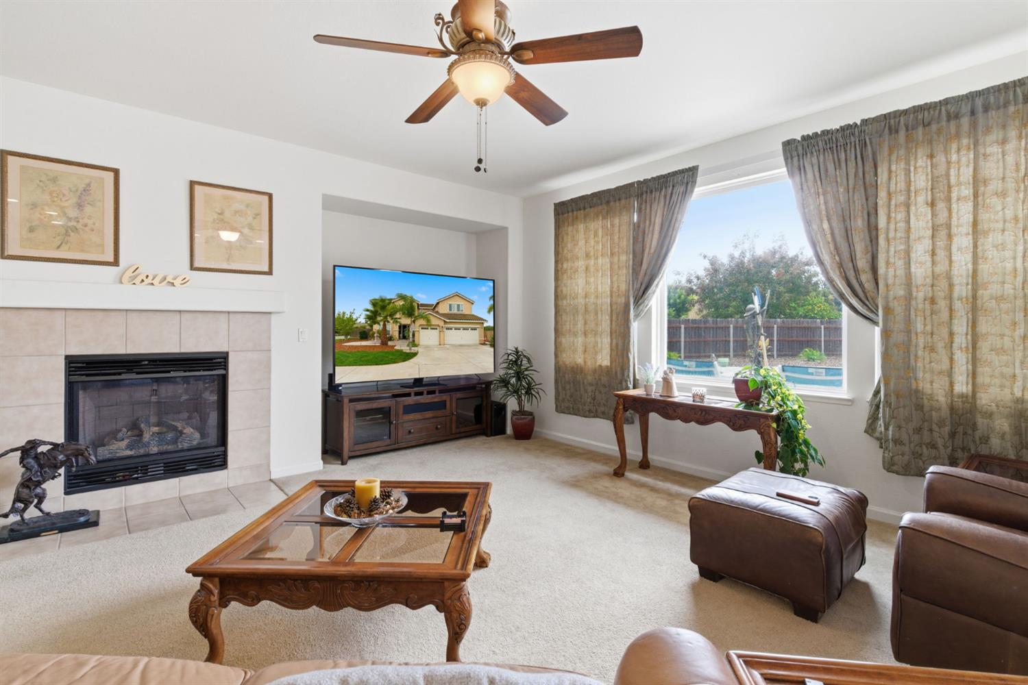 1806 West Ripon Road Ripon, CA 95366 - Photo 17 of 65 a living room with furniture and a fireplace