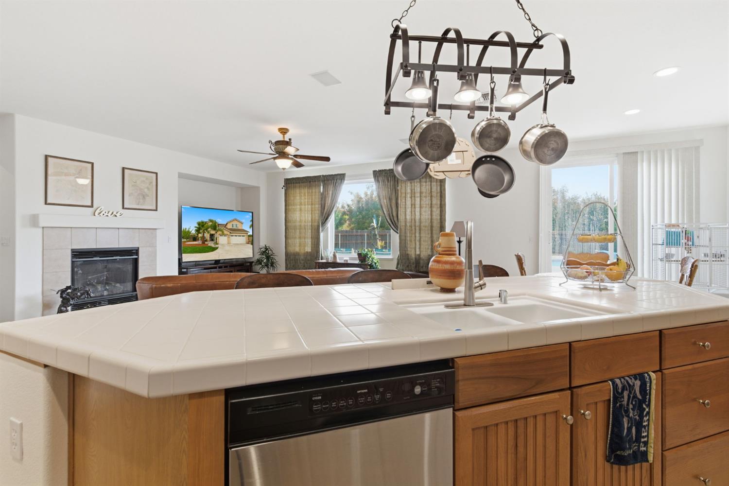 1806 West Ripon Road Ripon, CA 95366 - Photo 25 of 65 a kitchen with a sink and a clock on the wall