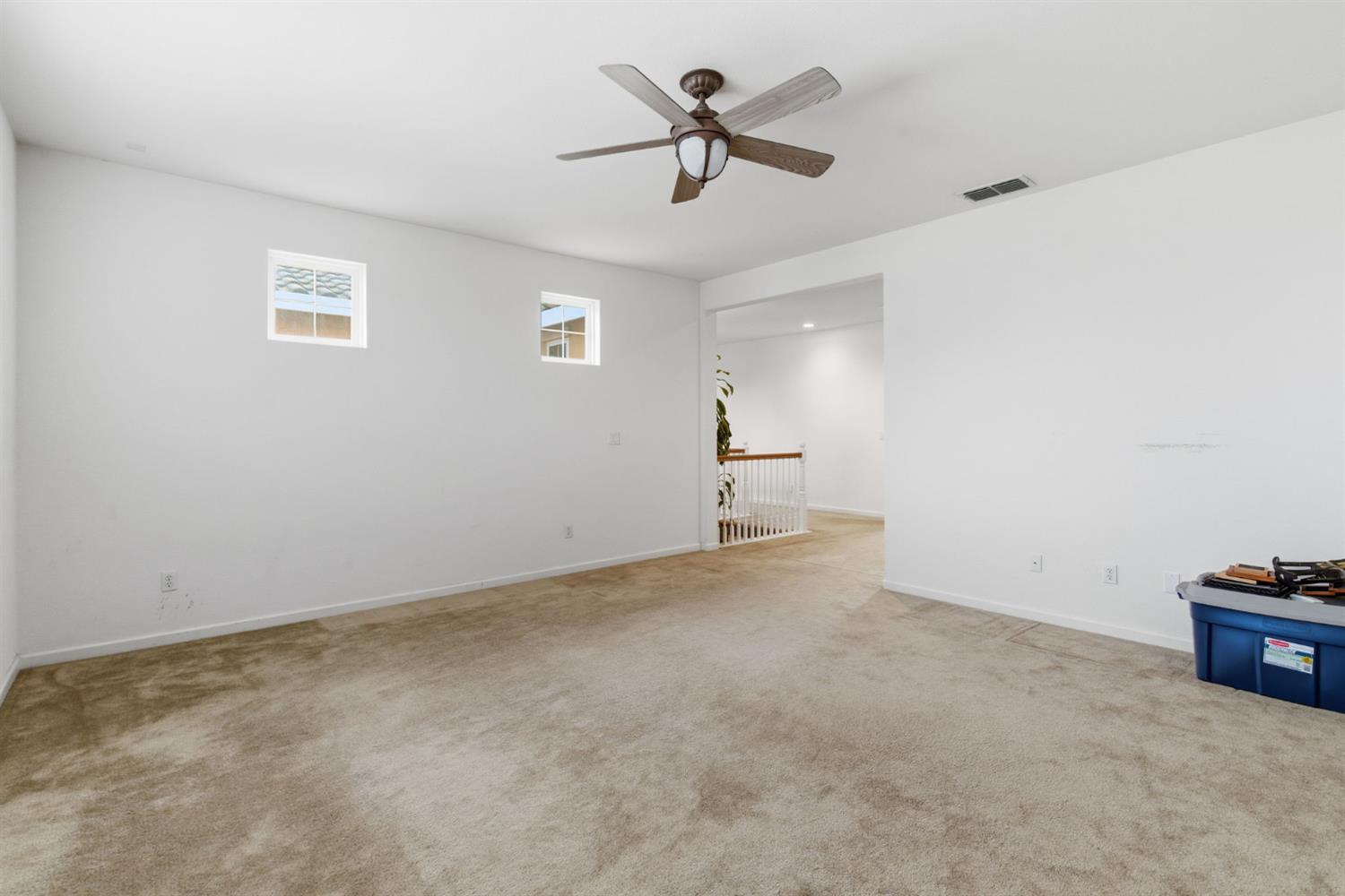 1806 West Ripon Road Ripon, CA 95366 - Photo 31 of 65 a view of a room with cabinet a ceiling fan and wooden floor