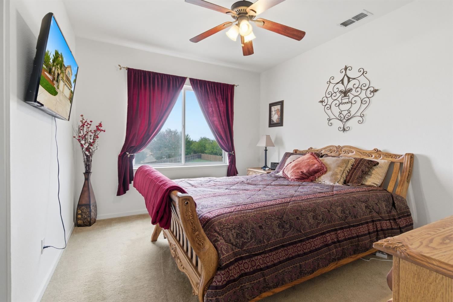 1806 West Ripon Road Ripon, CA 95366 - Photo 33 of 65 a bedroom with a bed and a painting on the wall