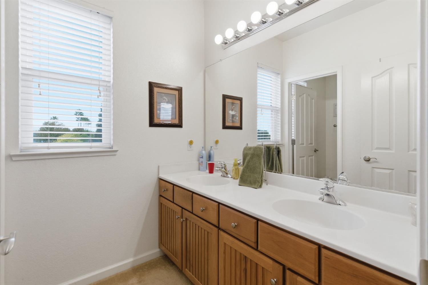 1806 West Ripon Road Ripon, CA 95366 - Photo 35 of 65 a bathroom with a sink double vanity and a mirror