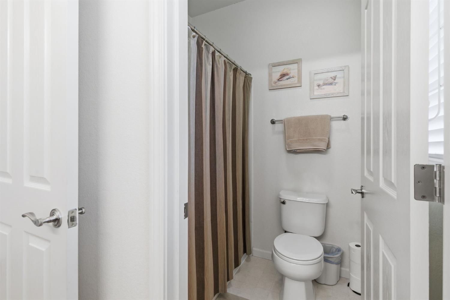1806 West Ripon Road Ripon, CA 95366 - Photo 36 of 65 a bathroom with a toilet and a sink