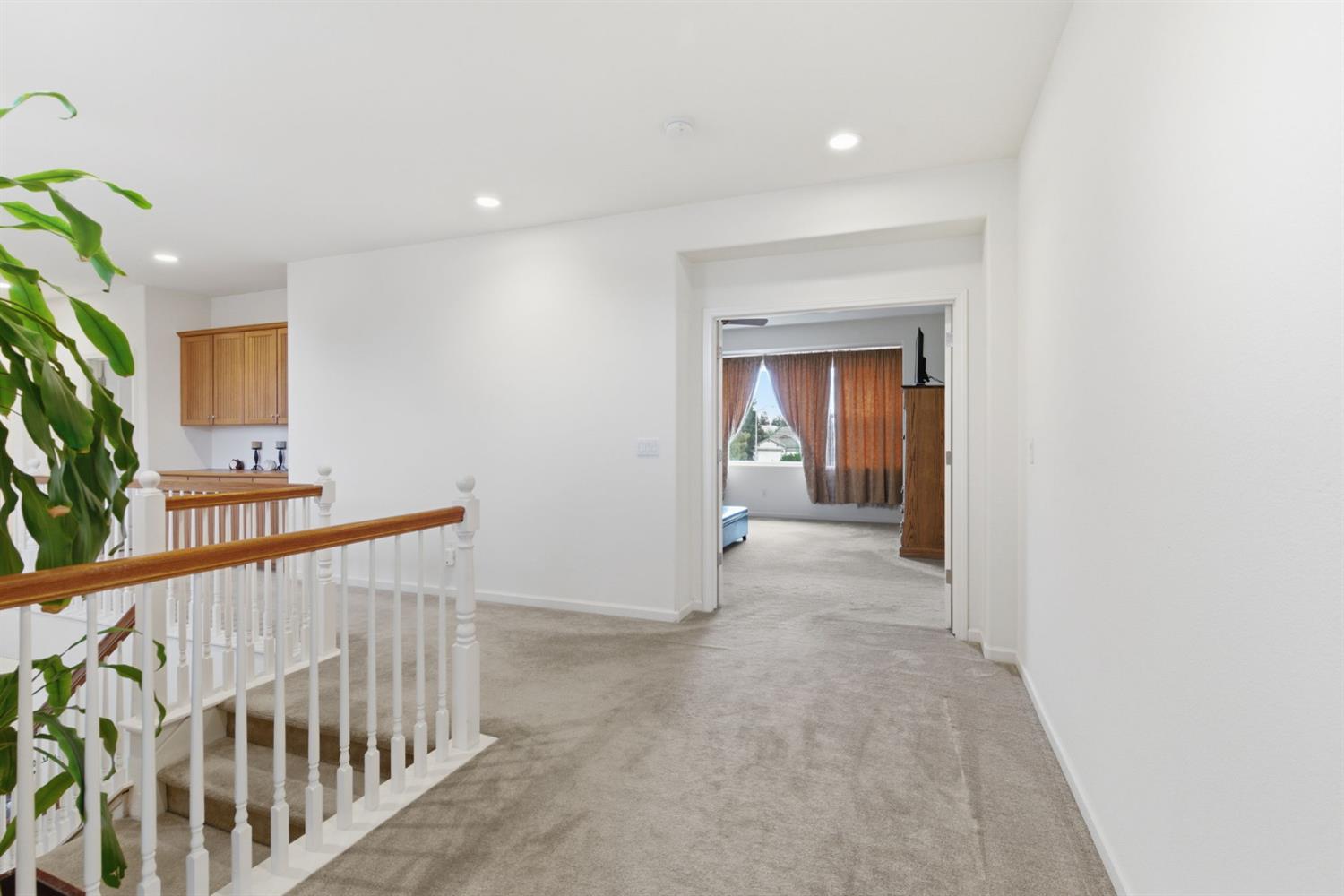 1806 West Ripon Road Ripon, CA 95366 - Photo 38 of 65 a view of a hallway with workspace