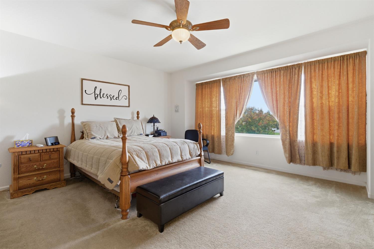 1806 West Ripon Road Ripon, CA 95366 - Photo 39 of 65 a spacious bedroom with a bed and a large window