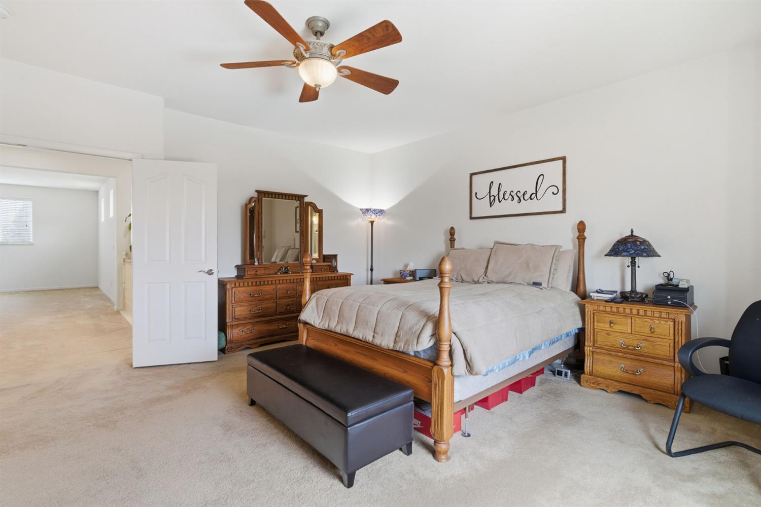 1806 West Ripon Road Ripon, CA 95366 - Photo 40 of 65 a bedroom with a bed and a chandelier