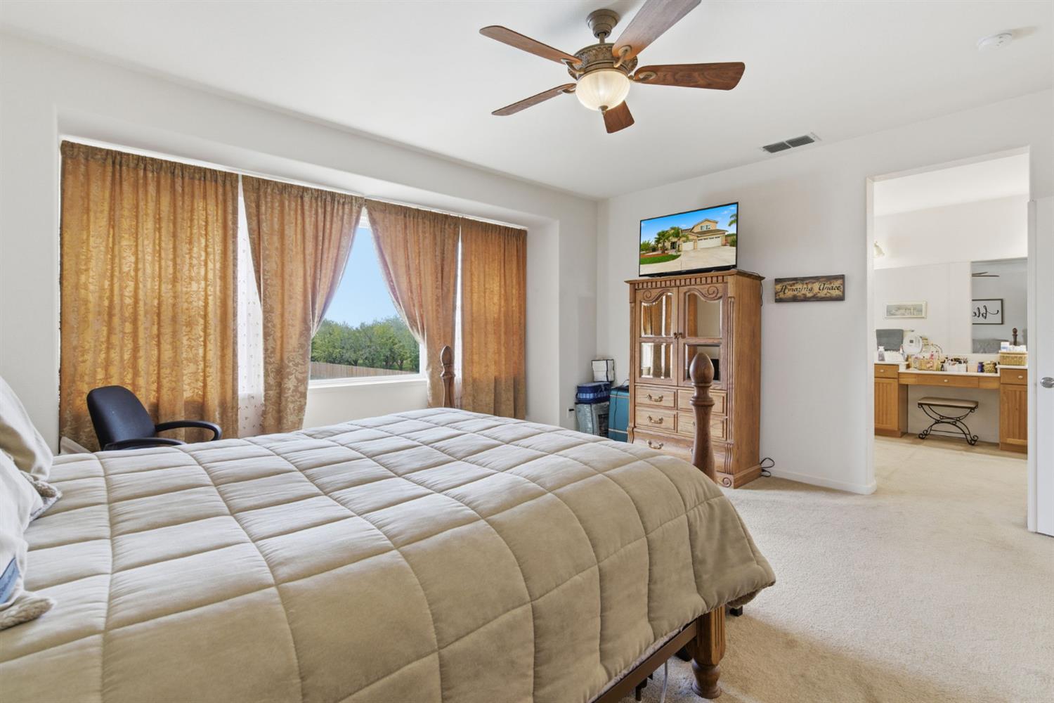 1806 West Ripon Road Ripon, CA 95366 - Photo 41 of 65 a bedroom with a bed and a large window