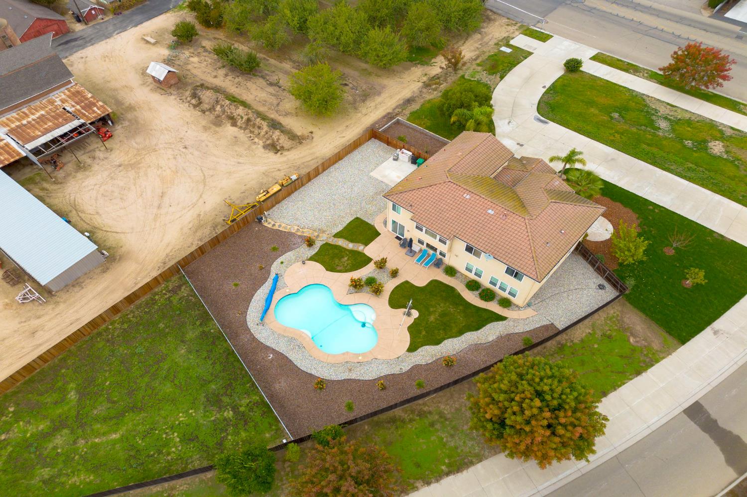 1806 West Ripon Road Ripon, CA 95366 - Photo 56 of 65 a view of a swimming pool with a yard
