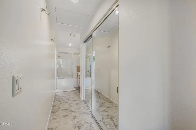a bathroom with a shower and a sink