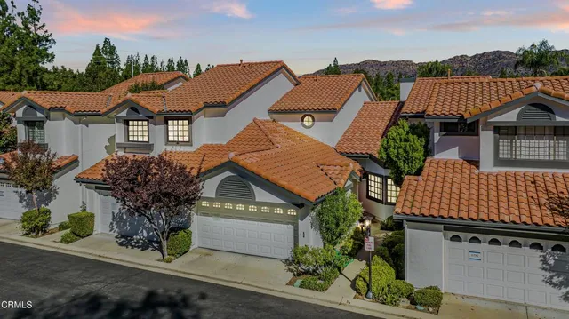 an aerial view of a house with a garden
