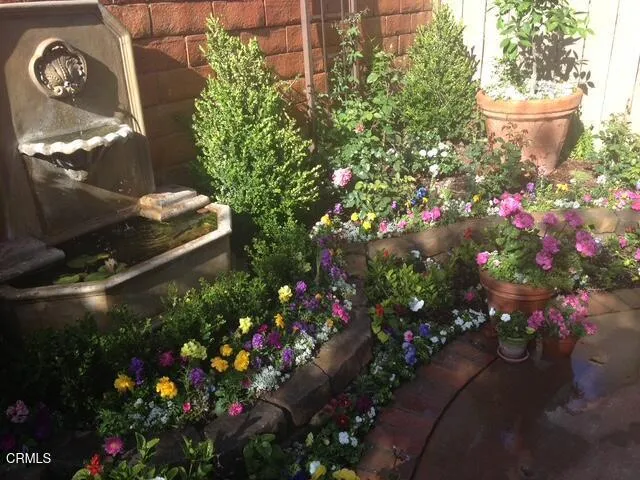 a view of backyard with outdoor seating and green space