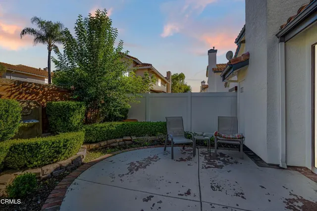 a view of a street with a bench in front of it