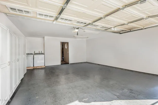 an aerial view of houses with street