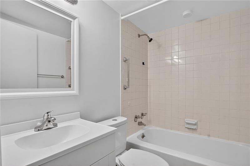 5 Bayard Road, Unit 500 Pittsburgh, PA 15213 - Photo 14 of 20 a bathroom with a sink toilet and shower
