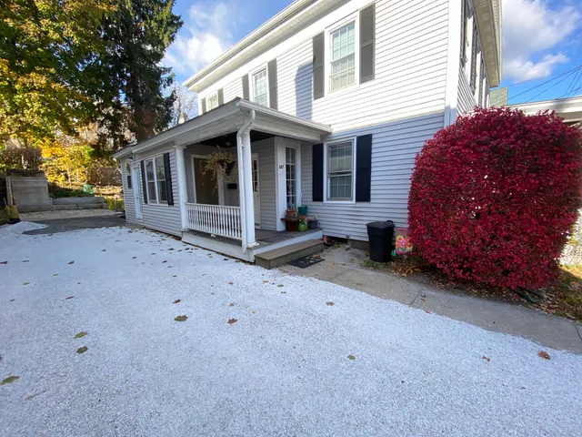 a view of a house with a yard