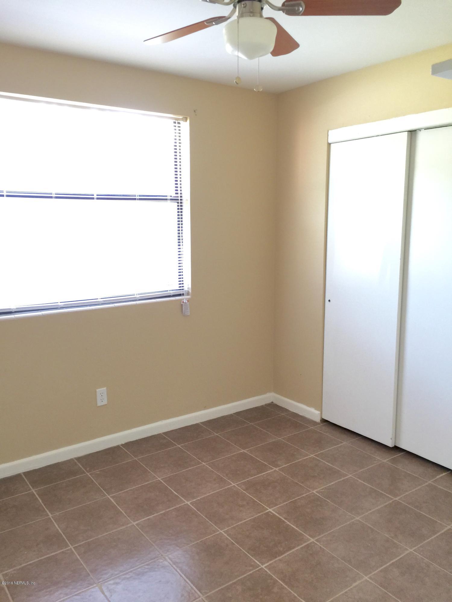 6121 Anvil Road Jacksonville, FL 32277 - Photo 23 of 31 a view of an empty room with a window