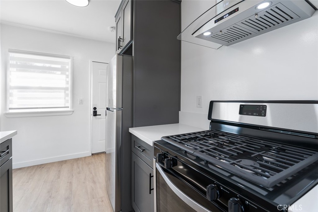 411-417 North Euclid Avenue Pasadena, CA 91101 - Photo 11 of 40 a stove sitting inside of a kitchen