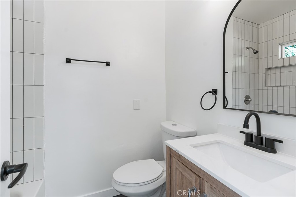 411-417 North Euclid Avenue Pasadena, CA 91101 - Photo 28 of 40 a bathroom with a sink a toilet and shower