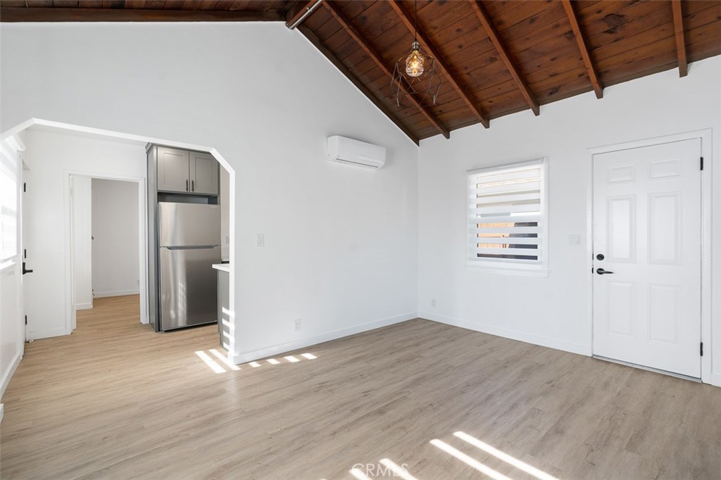 411-417 North Euclid Avenue Pasadena, CA 91101 - Photo 6 of 40 a view of empty room with wooden floor and fan
