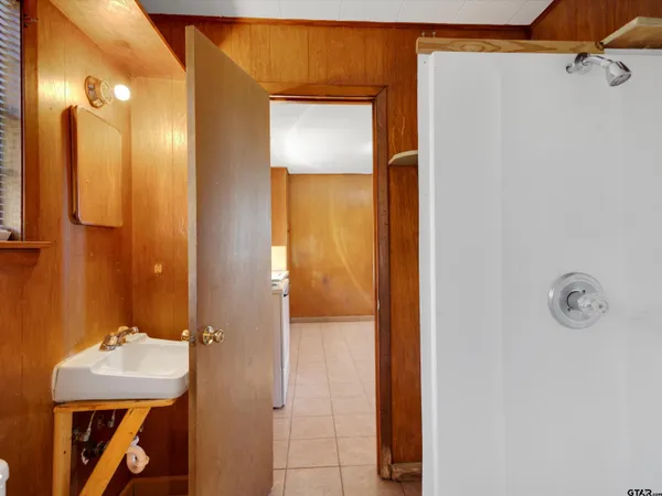 a bathroom with a sink and mirror