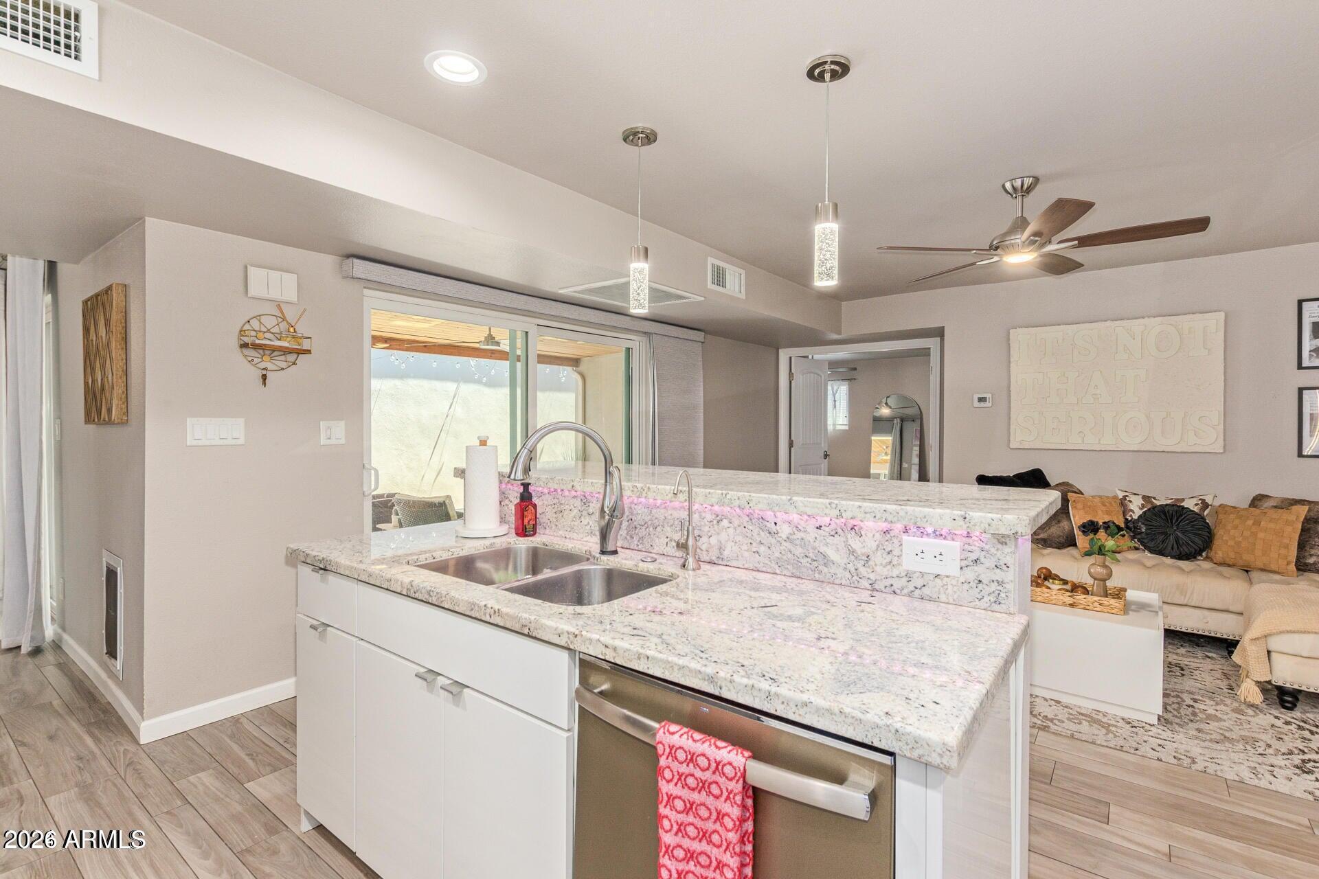 5913 East Thomas Road Scottsdale, AZ 85251 - Photo 6 of 26 a view of living room with granite countertop furniture and fireplace