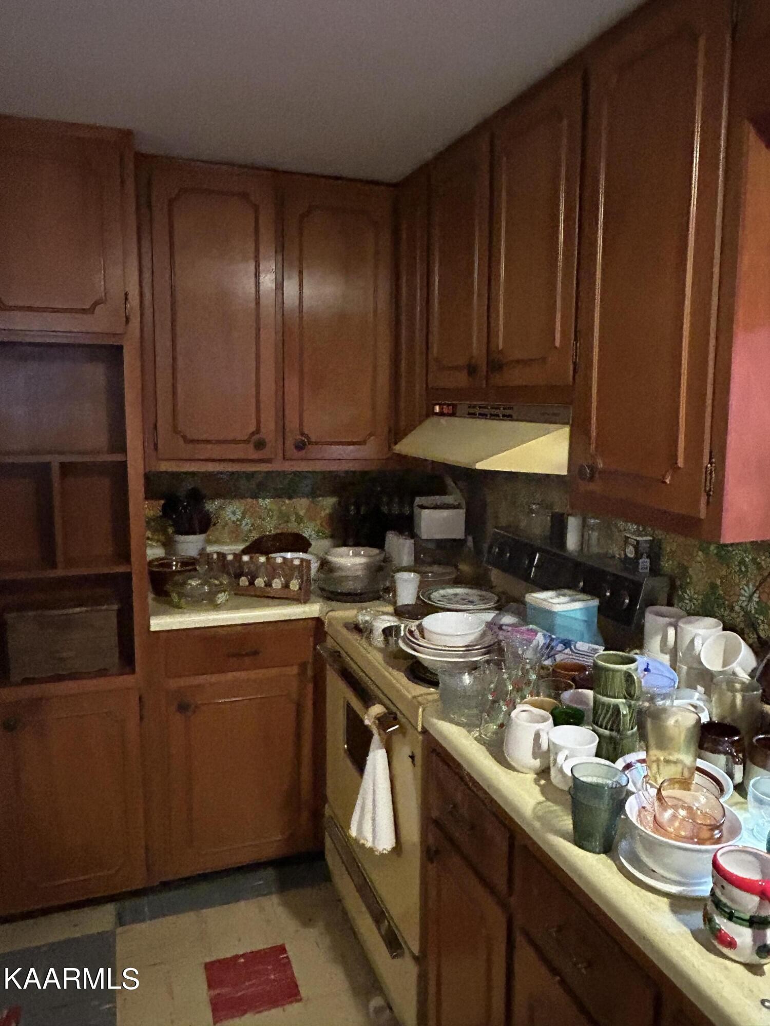 866 Niggs Creek Road Oneida, TN 37841 - Photo 8 of 39 a kitchen with a sink and cabinets