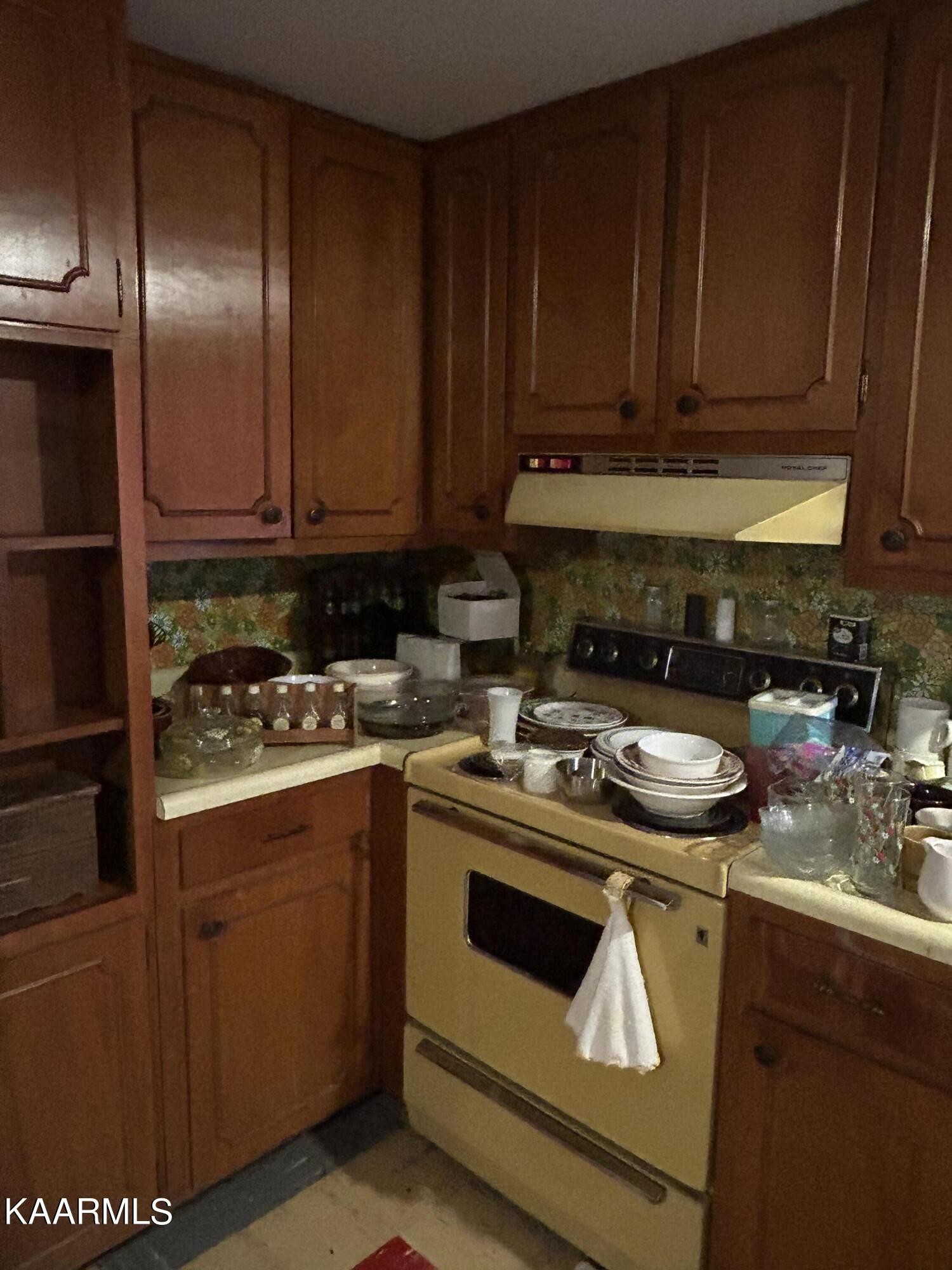 866 Niggs Creek Road Oneida, TN 37841 - Photo 9 of 39 a kitchen with a stove and a sink
