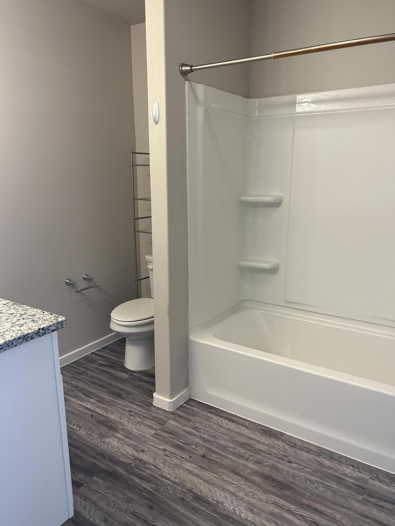 2122 North Texas Avenue Lubbock, TX 79403 - Photo 7 of 7 a bathroom with a shower a bathtub and a toilet