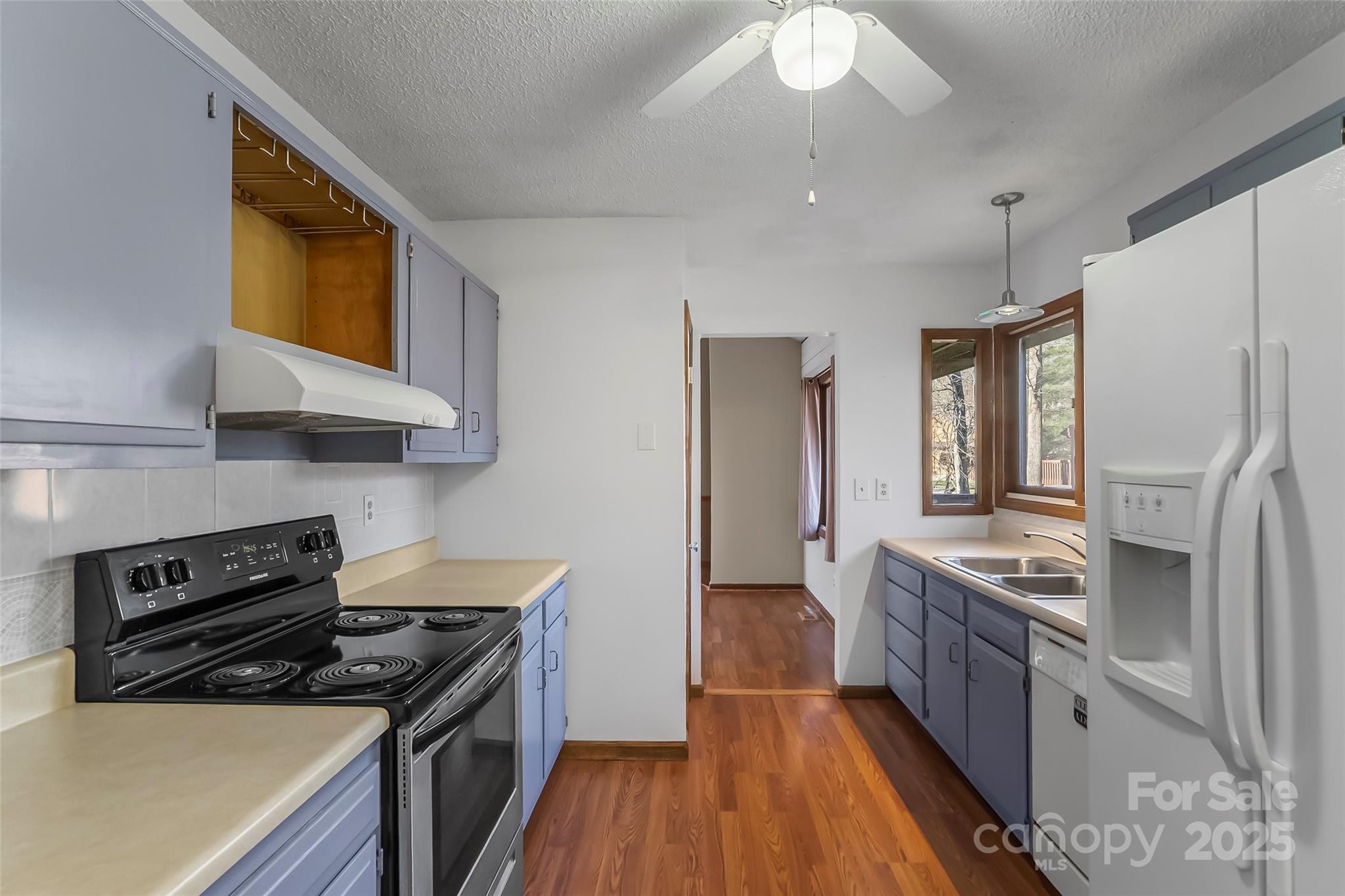 39 Oak Court Fletcher, NC 28732 - Photo 12 of 41 a kitchen with stainless steel appliances granite countertop a stove a sink and a refrigerator
