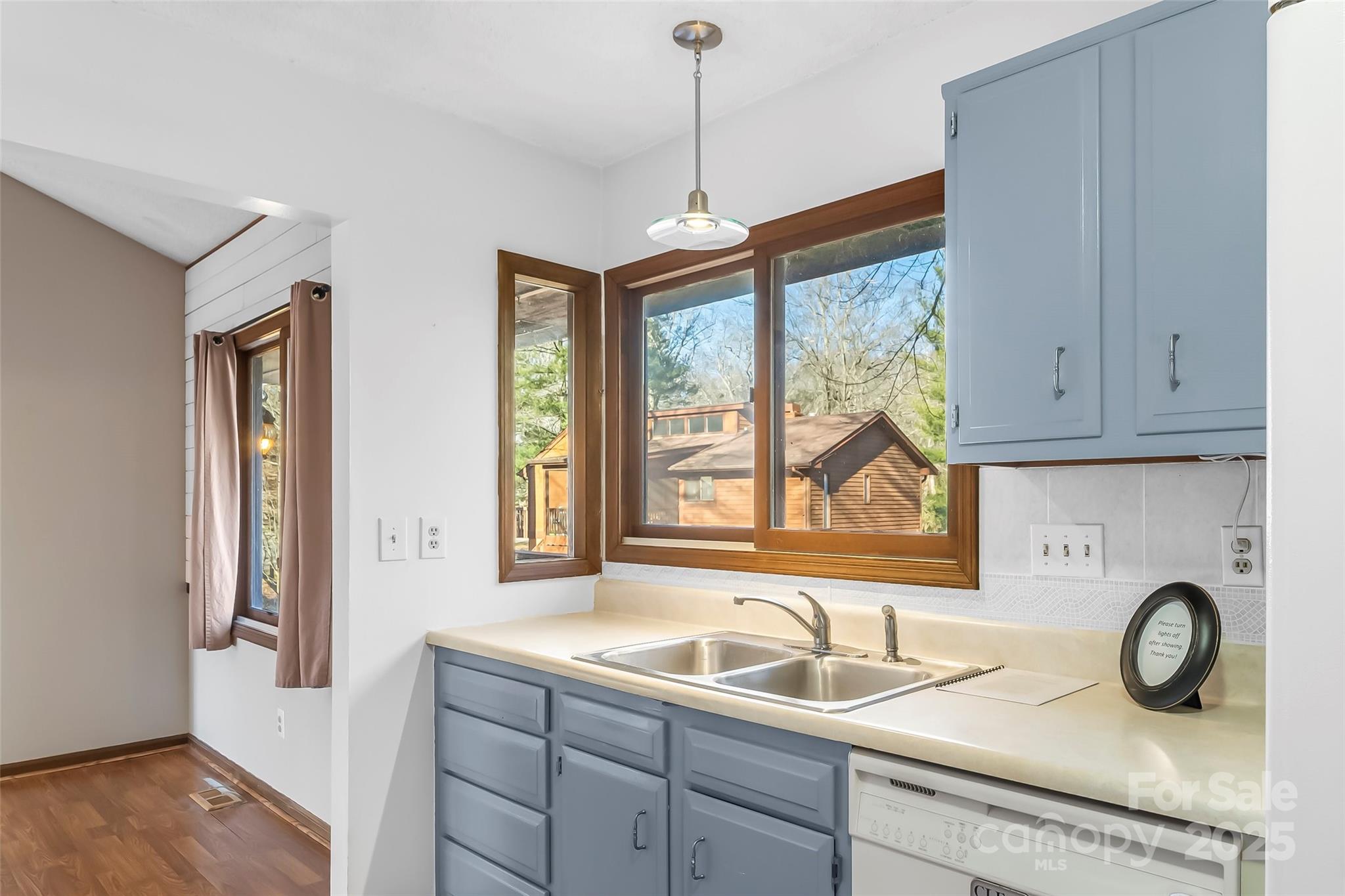 39 Oak Court Fletcher, NC 28732 - Photo 13 of 41 a kitchen with a granite countertop sink window and cabinets