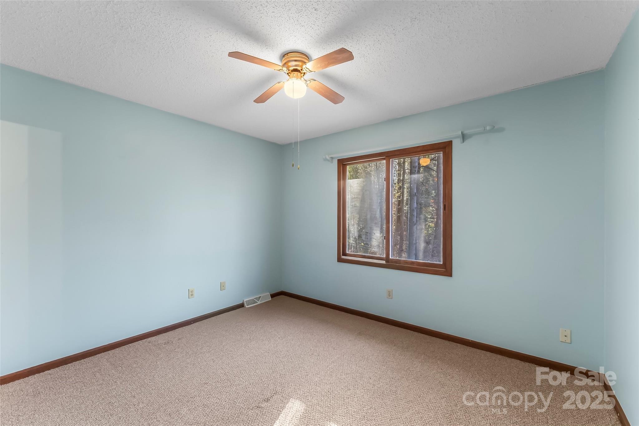 39 Oak Court Fletcher, NC 28732 - Photo 19 of 41 an empty room with window and ceiling fan