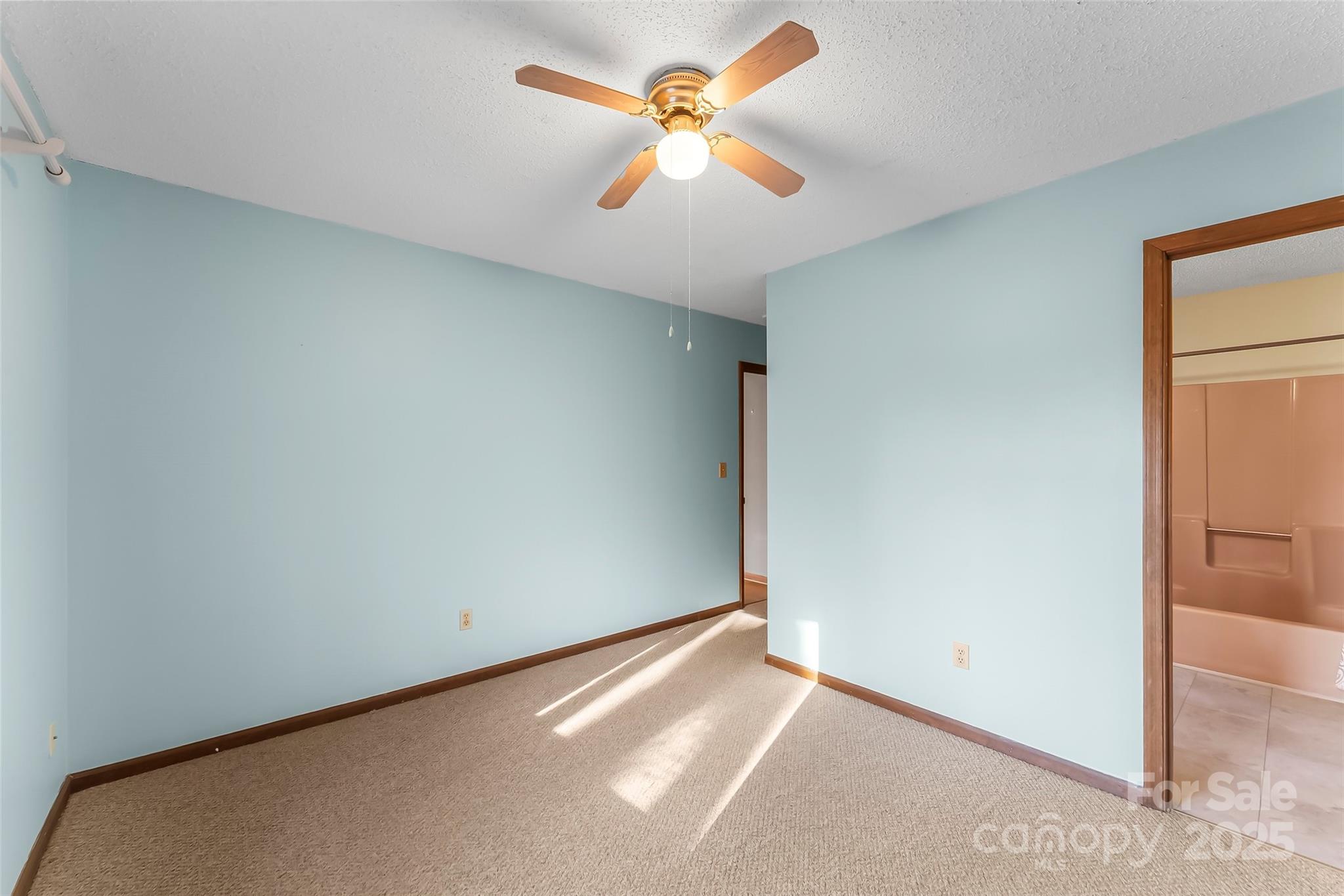 39 Oak Court Fletcher, NC 28732 - Photo 20 of 41 an empty room with closet and a chandelier fan