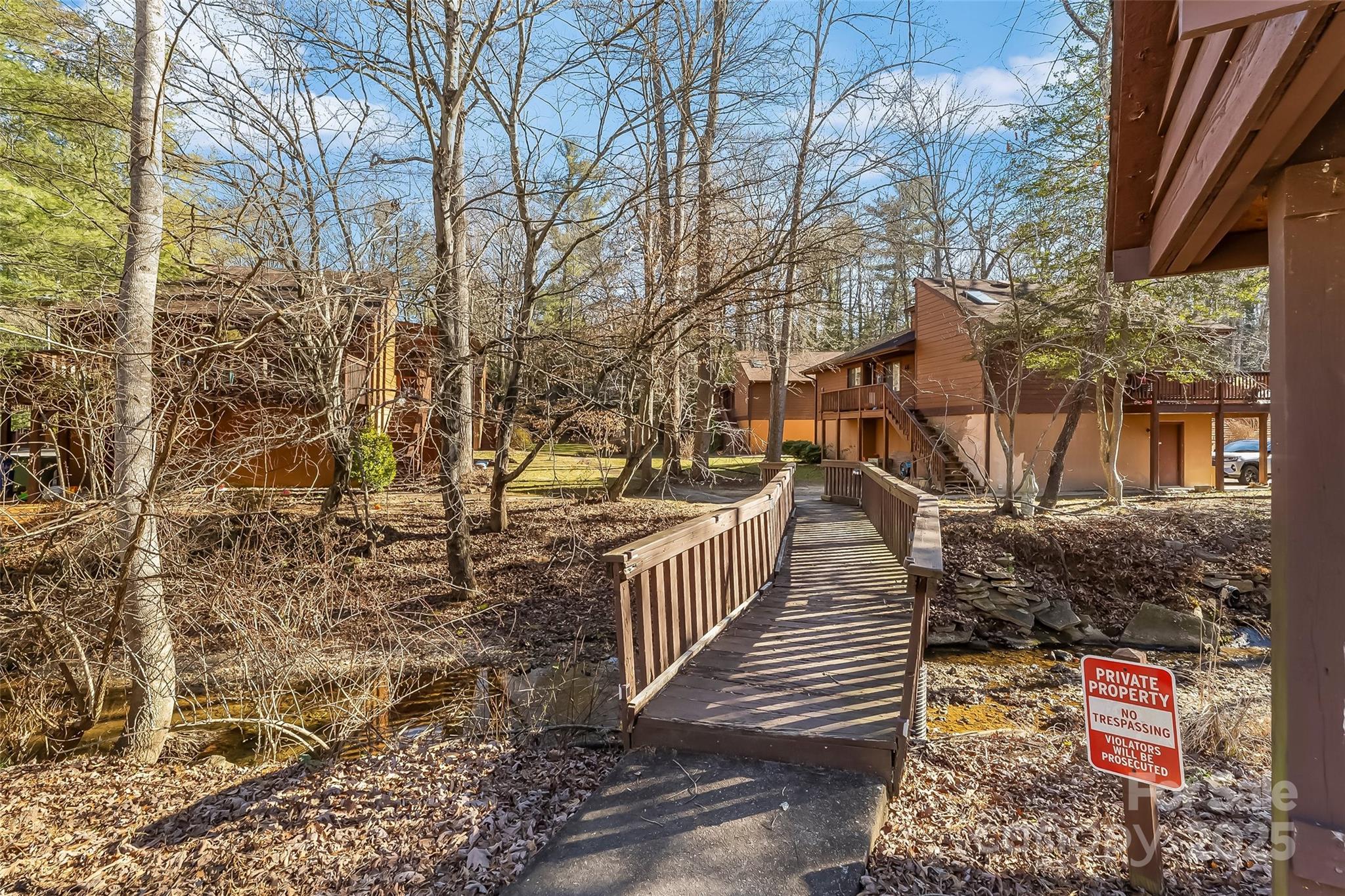 39 Oak Court Fletcher, NC 28732 - Photo 37 of 41 a view of a pathway with a wrought fence