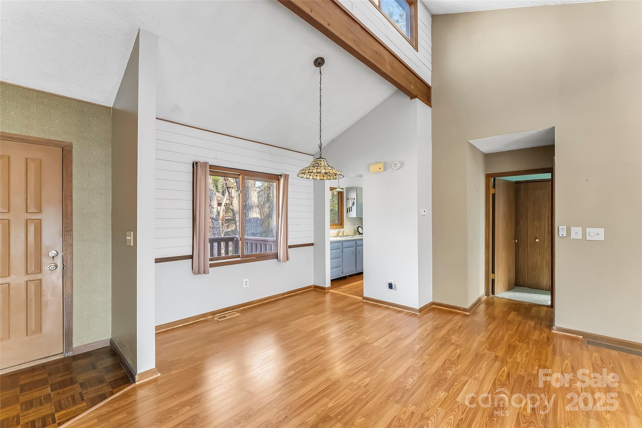 39 Oak Court Fletcher, NC 28732 - Photo 9 of 41 a view of an empty room with wooden floor and a window