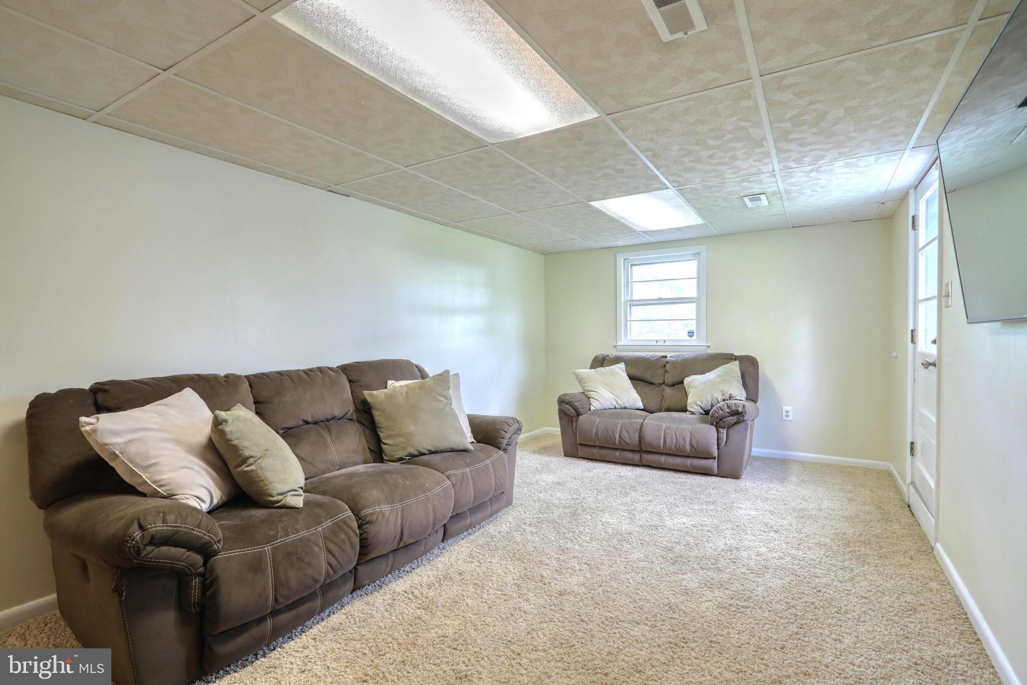 2427 Pine Grove Road York, PA 17403 - Photo 23 of 34 LL FAMILY ROOM W/ WINDOWS AND WALK OUT