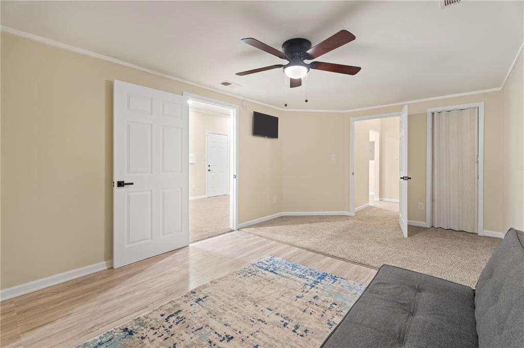 3292 Basking Shade Lane Decatur, GA 30034 - Photo 23 of 57 a view of a big room with wooden floor and windows