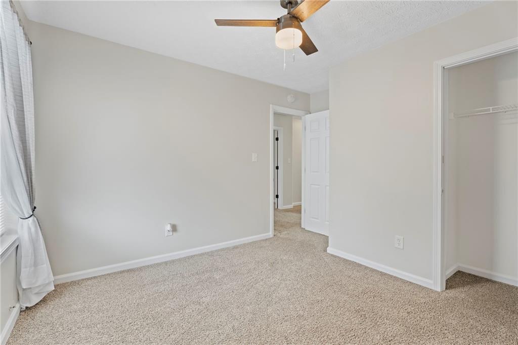 3292 Basking Shade Lane Decatur, GA 30034 - Photo 30 of 57 a view of a room with a ceiling fan and window