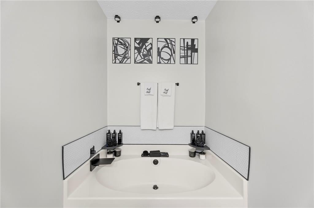 3292 Basking Shade Lane Decatur, GA 30034 - Photo 36 of 57 a bathroom with a sink and mirror