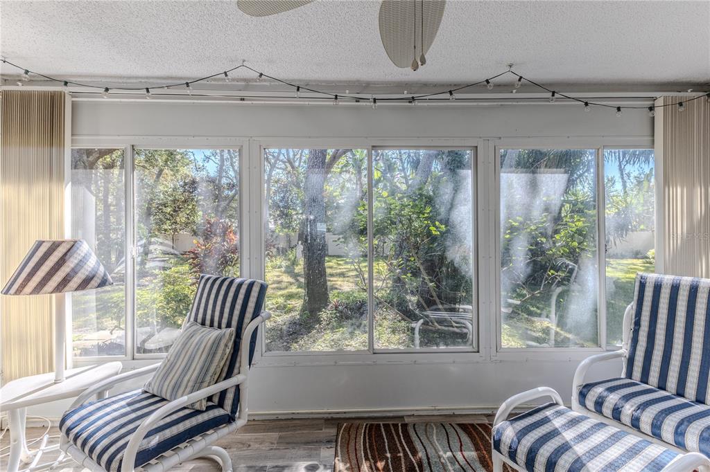 6375 Ocean Pines Lane Spring Hill, FL 34606 - Photo 31 of 50 a view of a porch with furniture and a window