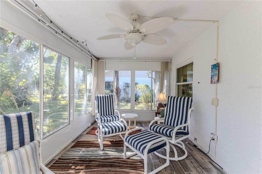 6375 Ocean Pines Lane Spring Hill, FL 34606 - Photo 32 of 50 a view of a bedroom with wooden floor and balcony
