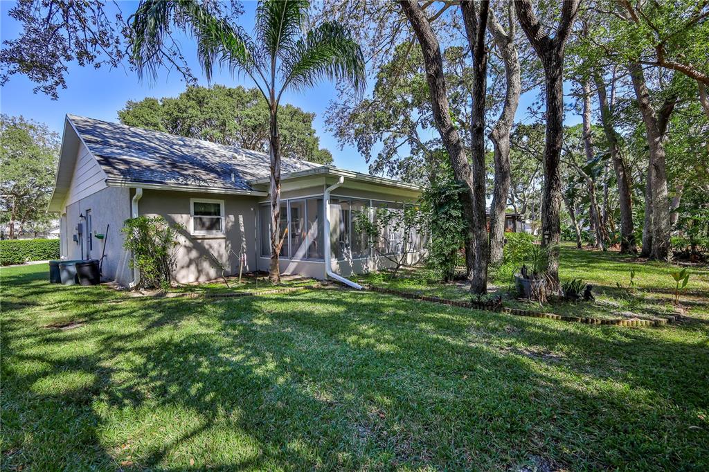 6375 Ocean Pines Lane Spring Hill, FL 34606 - Photo 36 of 50 a view of a chair and table in backyard of the house