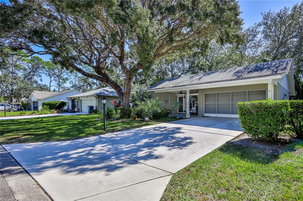 6375 Ocean Pines Lane Spring Hill, FL 34606 - Photo 4 of 50 a view of a house with a yard