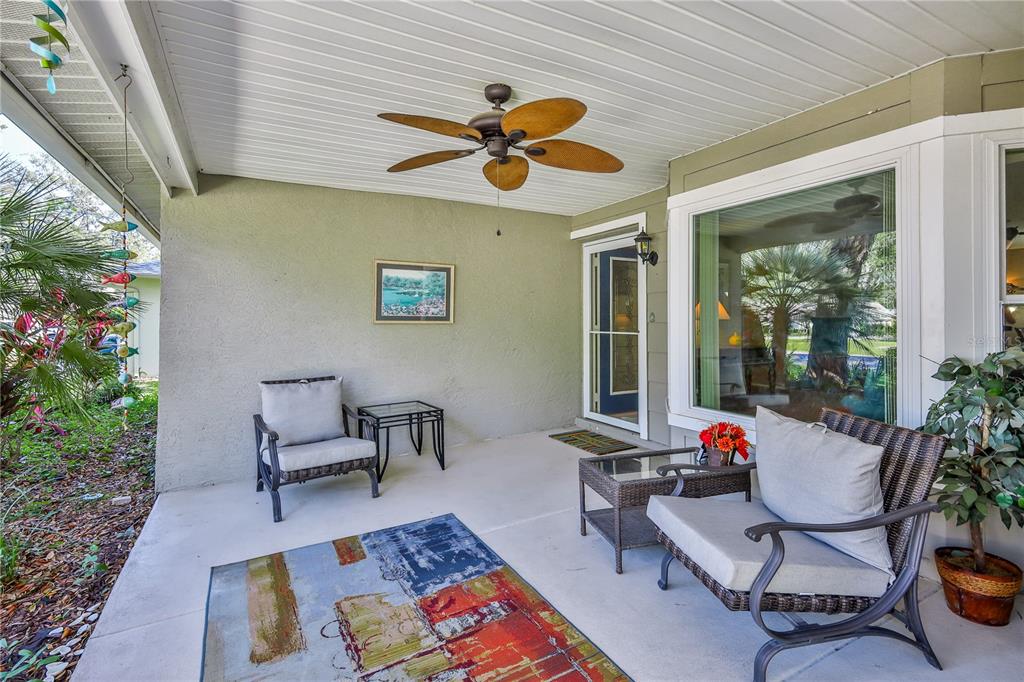 6375 Ocean Pines Lane Spring Hill, FL 34606 - Photo 5 of 50 a living room with furniture and a potted plant