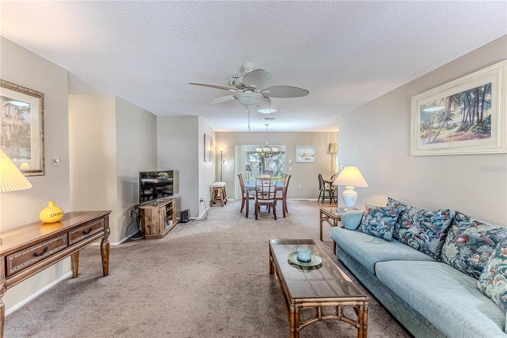 6375 Ocean Pines Lane Spring Hill, FL 34606 - Photo 10 of 50 a living room with furniture and wooden floor
