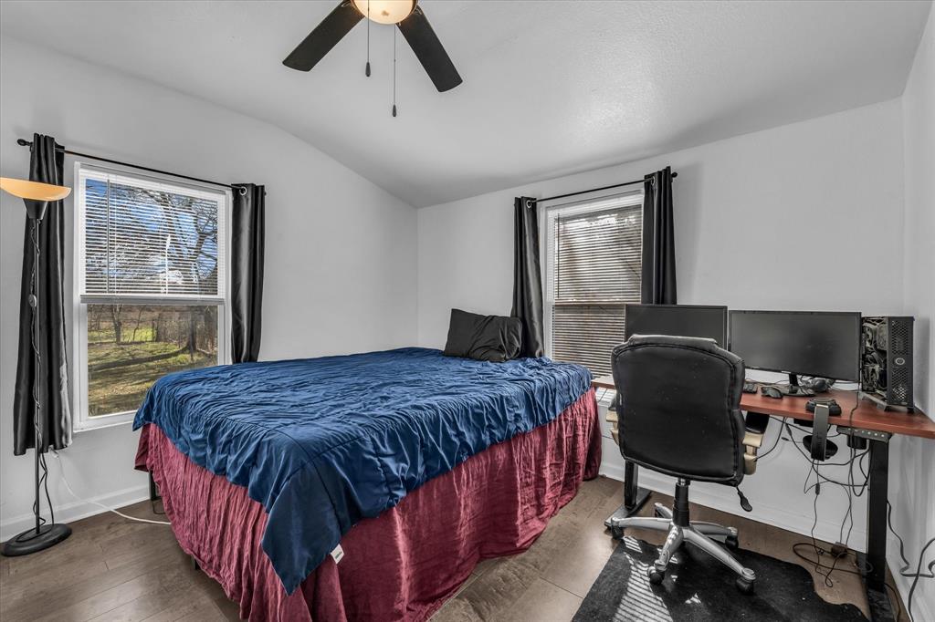 1209 Southey Street Waco, TX 76704 - Photo 11 of 21 a bedroom with a bed window and chair