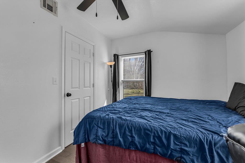 1209 Southey Street Waco, TX 76704 - Photo 12 of 21 a bedroom with a bed and a dresser